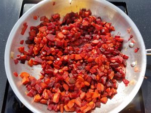 beets, carrots & onions in a pan